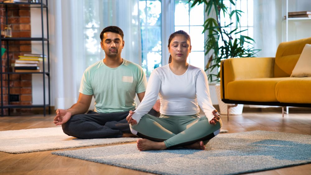 Woman meditating with partner or practising mindfulness